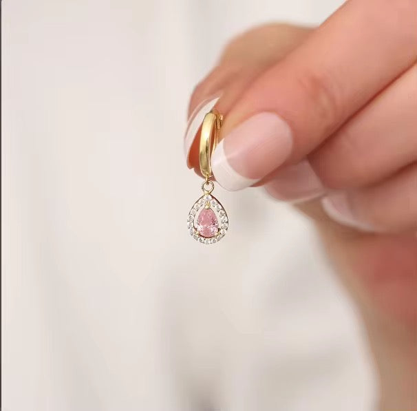 Bring timeless charm to your look with our Crystal Teardrop Huggie Earrings, available in Maroon, Green, and Pink.