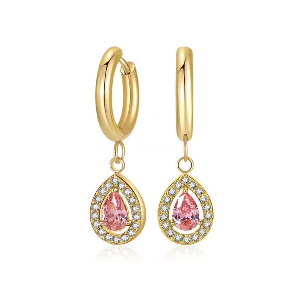 Bring timeless charm to your look with our Crystal Teardrop Huggie Earrings, available in Maroon, Green, and Pink.