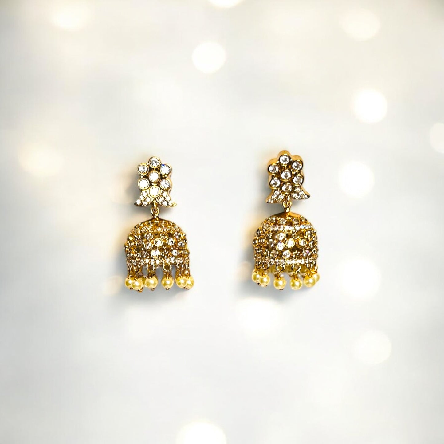 Vintage Elegance: Antique Gold Jhumka with Sparkling Stones and Pearls